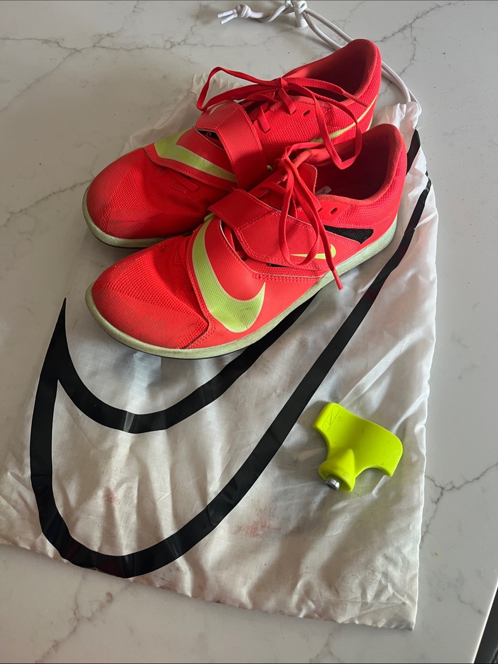 Nike Women's Neon Red and Volt  rival jump spikes.